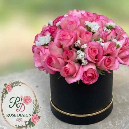 Luxury pink rose arrangement in a black hatbox by Rose Design Lahore.